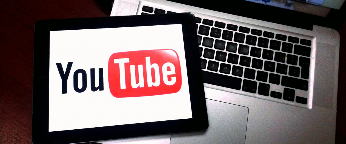 Tablet with Youtube Logo on Laptop